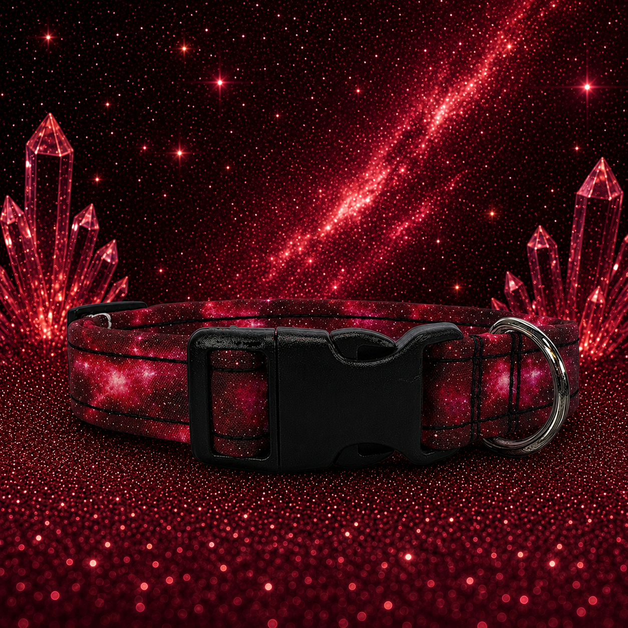 A red galaxy print dog collar with a black plastic buckle and a silver metal ring, displayed against a dark red glittery cosmic background with crystal graphics.
